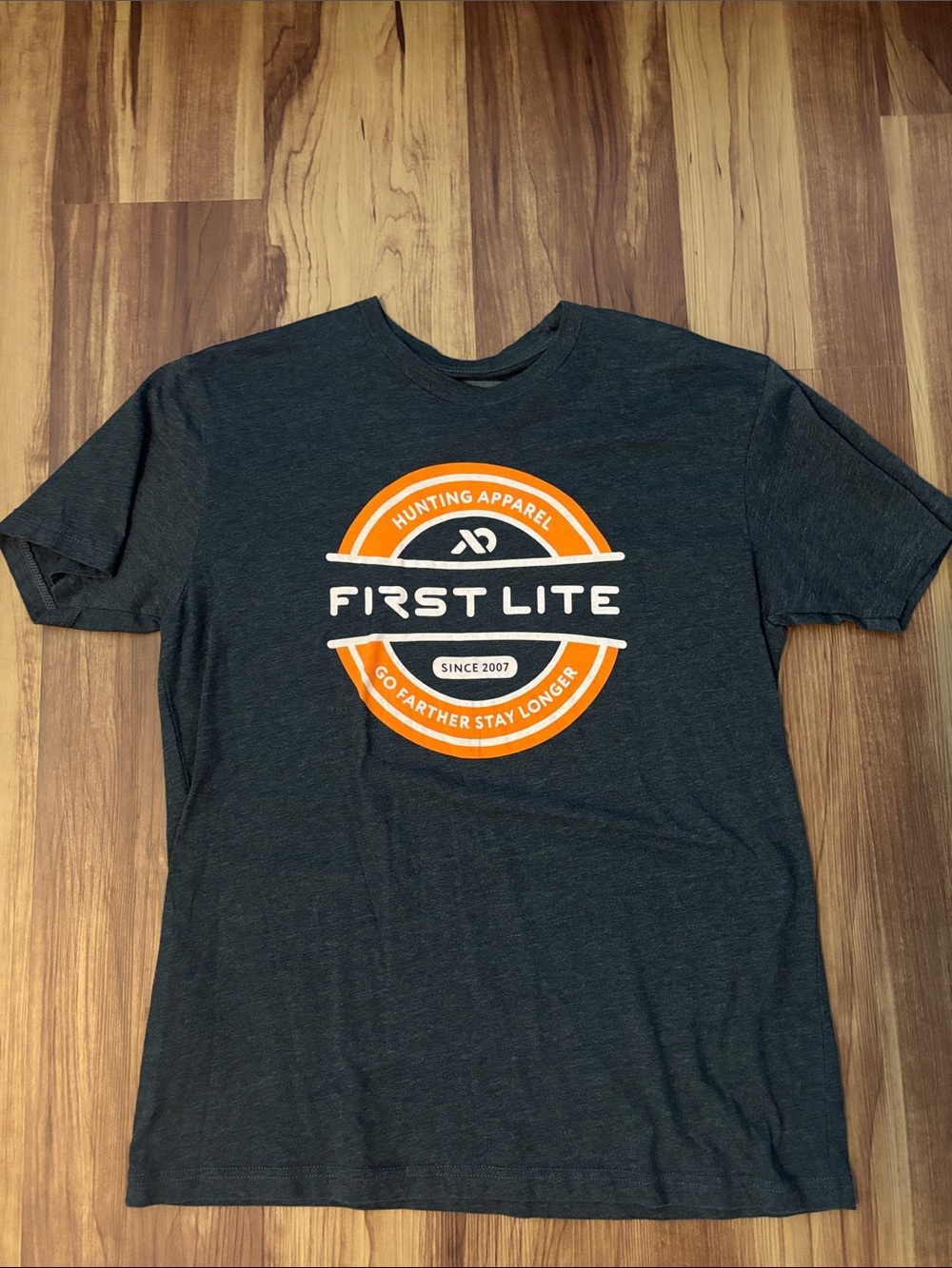 First Lite Dark Charcoal Short-Sleeve Tee with Orange and White Logo